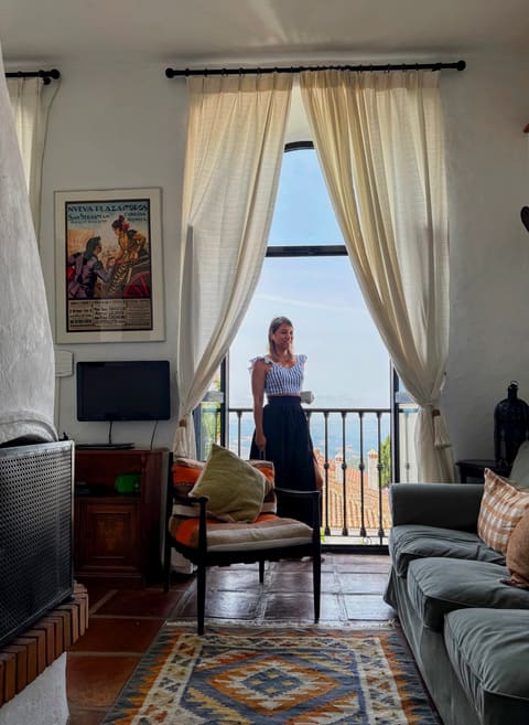 Liza relaxing in the Molino Escamillos living room, with a view